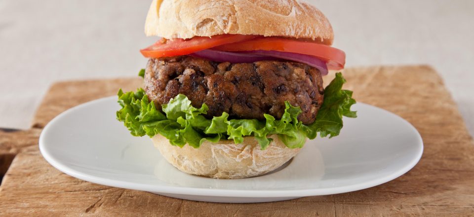 a plate with a black bean burger