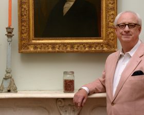 a profile of marsden next to a jar of red beans