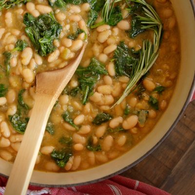 a dutch oven full of White Bean and Spinach Soup