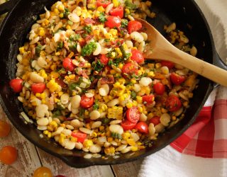 a cast iron pot full of southern summer succotash