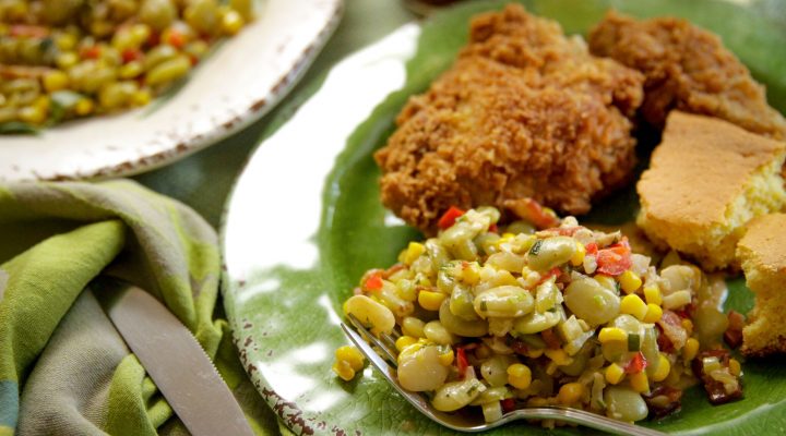 a plate of succotash fried chicken