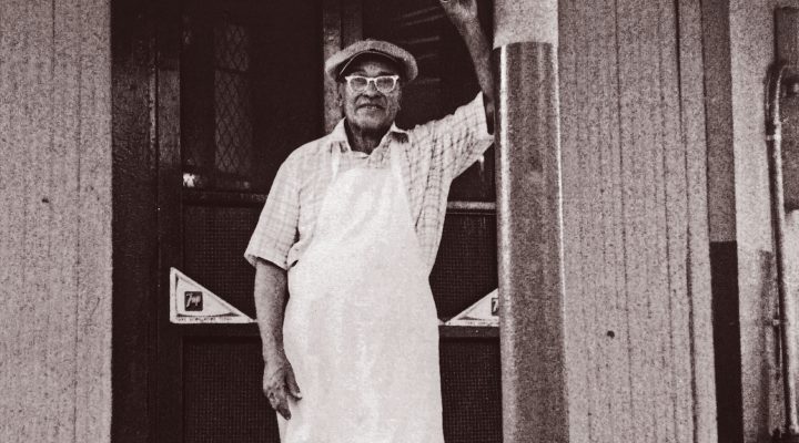 Buster Holmes in front of his restaurant