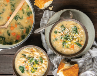 a top down view of creamy beans and collard greens soup