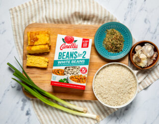 White Beans for 2 box next to uncooked rice and spices and french bread