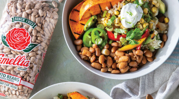 2 bowls of cooked Chiupolte Burrito Bowls next to open, spilled bag of Camellia Pinto Beans