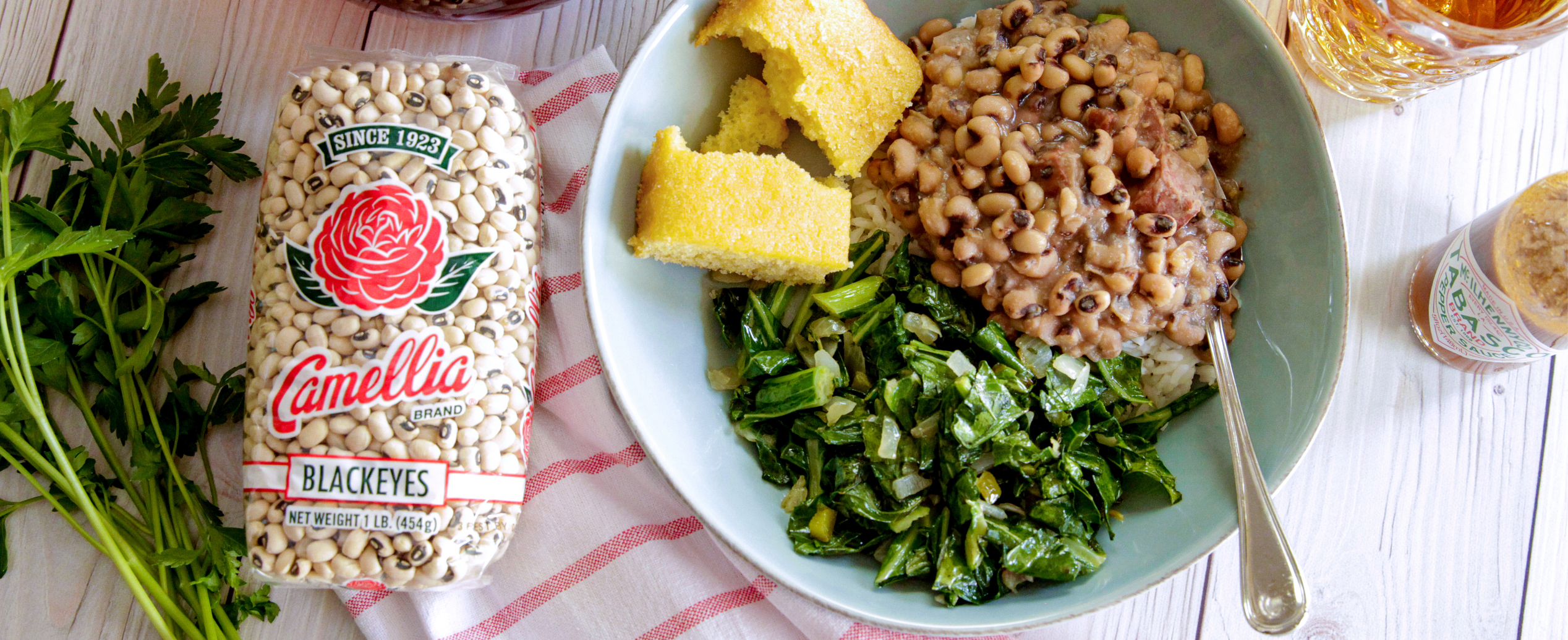 blackeye peas-corn bread-greens-in-green-bowl-and product