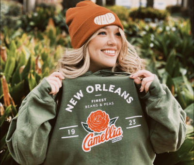 Girl wearing a Camellia branded sweater and beanie